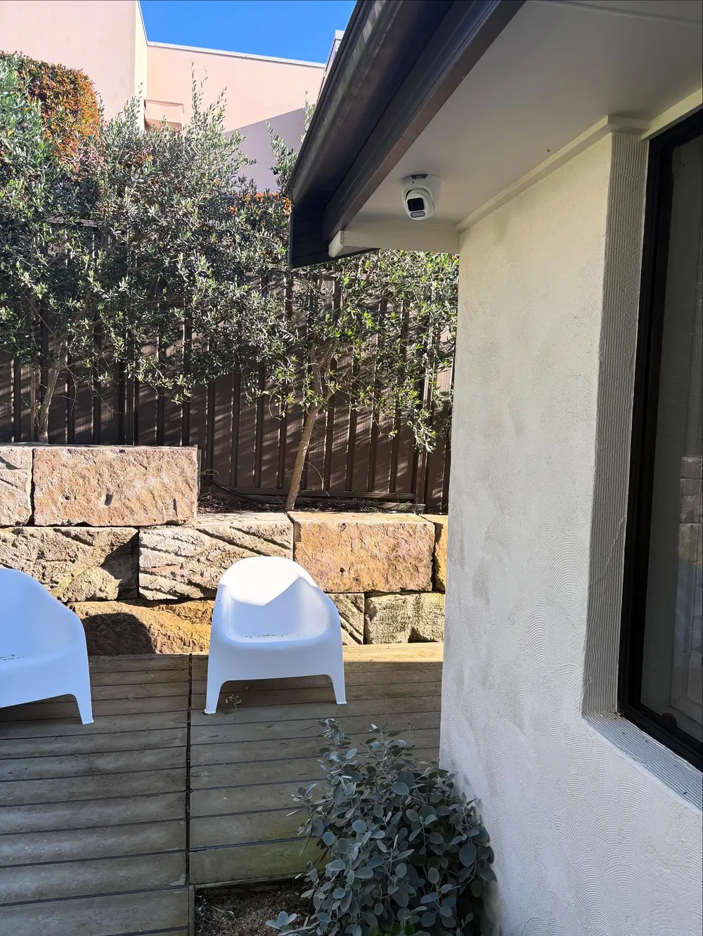 Outdoor Uniarch Owlview security camera installed under the eave of a Port Stephens home